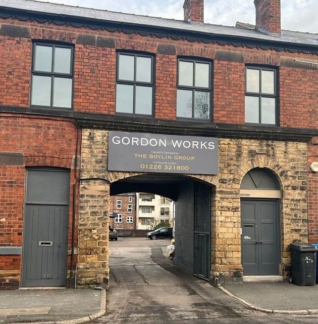 Straight-on view of the Gordon Works archway entrance on Valley Road